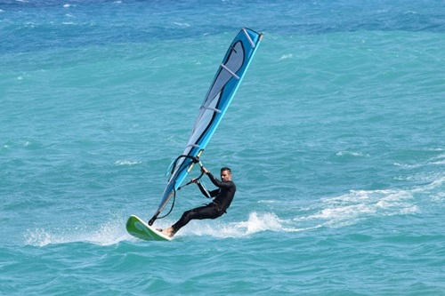 Catch the wind and carve the waves with windsurfing –Water Sports
