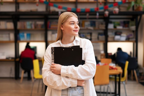 young woman looking in library